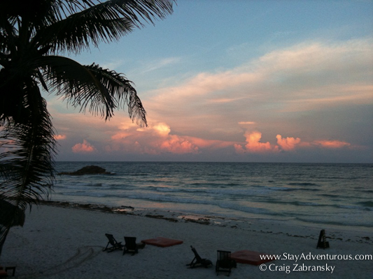 sunset on the beach of casa del miel in tulum mexico 