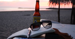 writing in a journal at sunset in mexico