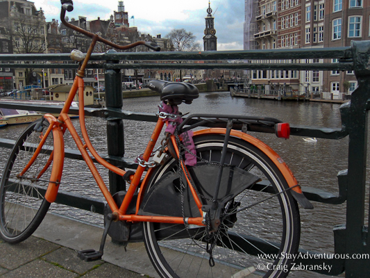 a bike on a canal bridged in Amersterdam Holland