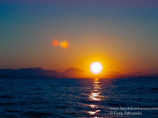 a sunset sailing the greek isles on the ionian sea