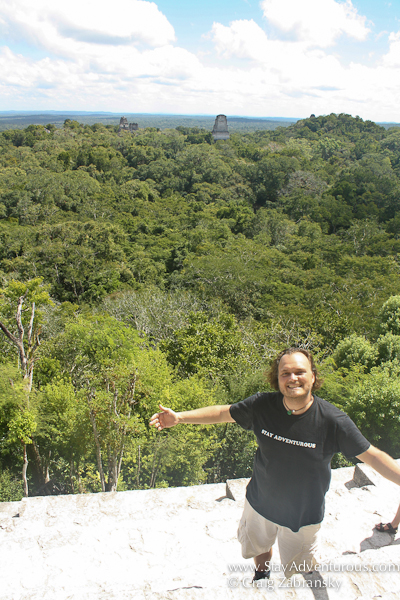 Craig Zabransky of Stay Adventurous on top of Templo IV Pyramid at the Mayan Ruins of Tikal, Guatemala