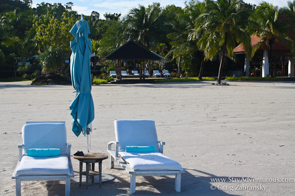 the beach at the Four Seasons Resort Langkawi Malaysia with lounge chairs