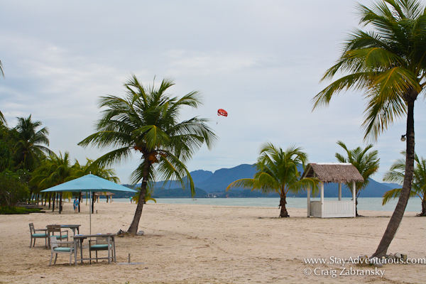 the beach at the Four Seasons Resort Langkawi Malaysia with a parasail