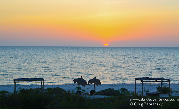 the sunset from xixim hotel, a uniqe mayan hotel outside of celestun, yucatan, mexico 