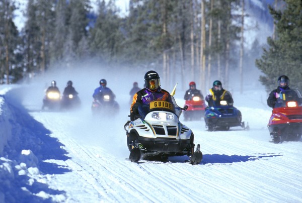 snow mobile through Grand Teton National Park in the winter