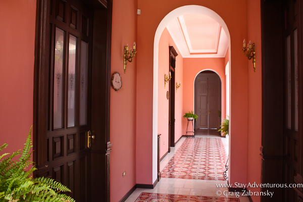 walking the corridor inside the annex at Casa Azul Boutique Hotel in Merida, Yucatan, Mexico