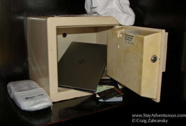 stuffing a notebook into a safe