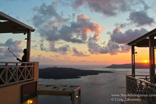 a sunset selfie, with a selfie stick in Fira, Santorini, Greece