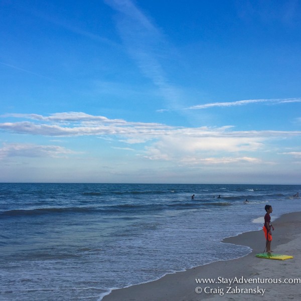 Child looks at the waves in Ponte Vedra, Florida