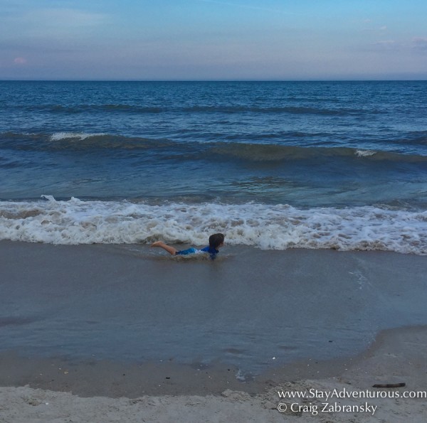 Child enjoying the waves and the beach in Ponte Vedra, Florida