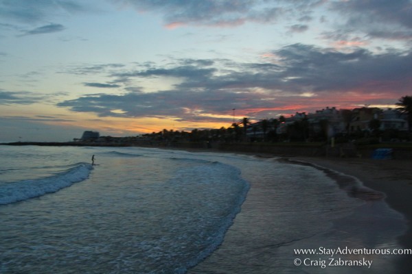 surfing at sunset in sitges spain