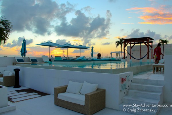 the sunset view of the main pool on the roof of the Palm at Playa in Playa del Carmen, in the Riviera Maya of Mexico