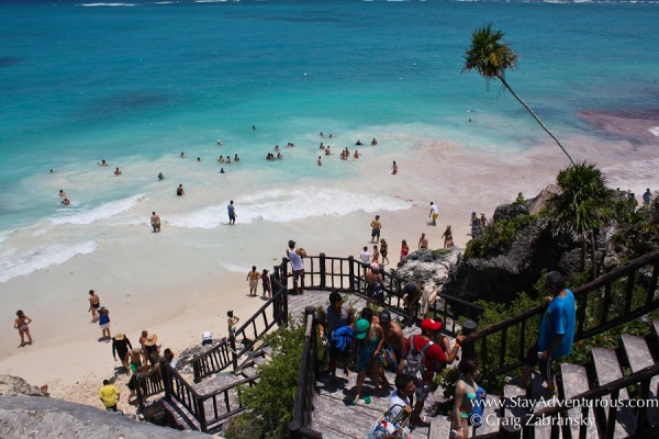 the crowded stairs on the way down to the public beach at the mayan ruins of Tulum