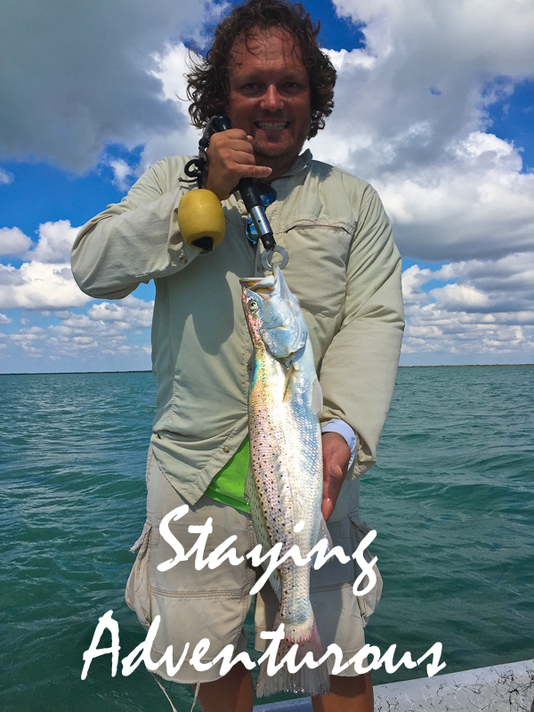 showing off speckled trout caugh in laguna madre on trip to south padre island, texas