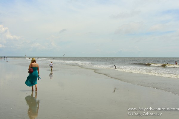 Woman and Child enjoying a stroll on the sands at hunting state park near beaufort, south carolina