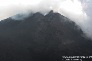 it's not all fog, there is smoke exiting the volcano...