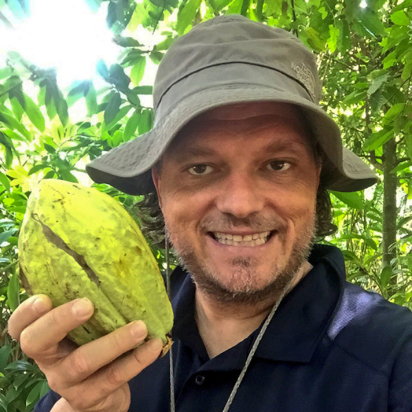 Craig Zabransky Staying Adventurous in Tabasco Holding a Cacao Fruit