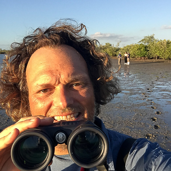 blogger with binoculars bird watching in la paz, baja california sur, mexico