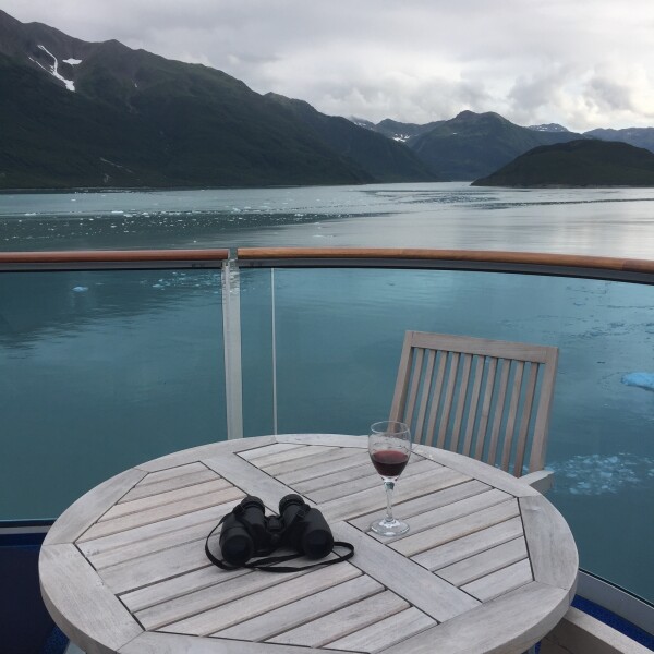 glass of wine in yakutat bay, alaskan cruise 