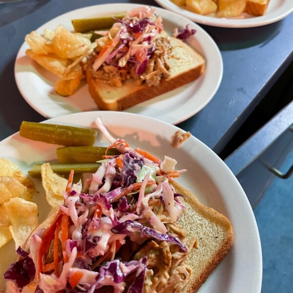 vegan BBQ jackfruit with chips and pickle