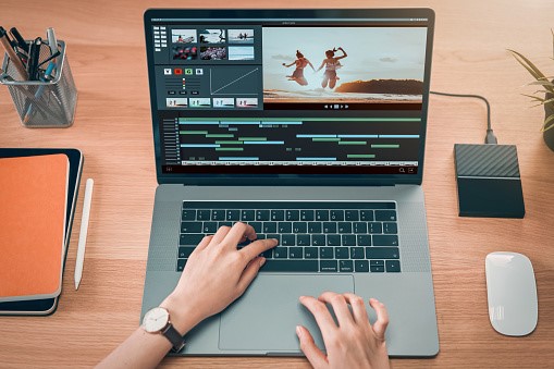 edit your footage on a laptop