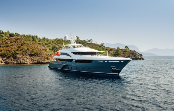 Yacht in the water on the coast. 