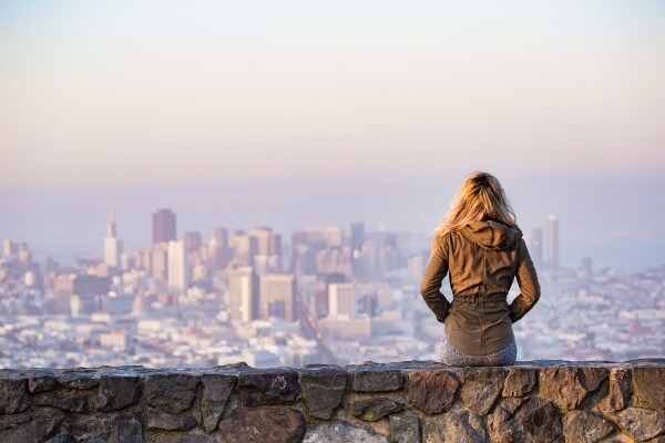 blonde staring off to city