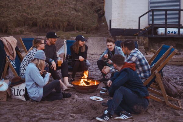 camping on the beach with fire marshmallows