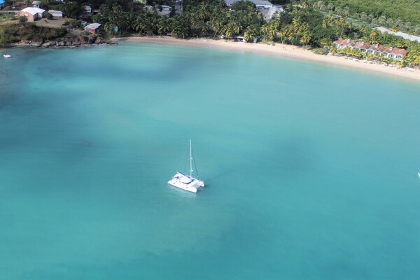 the beautiful beaches of barbados, catamaran in blue ocean caribbean