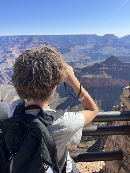 kid looking at the south rim of grand canyon us national park